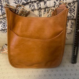 Ah-dorned cross body